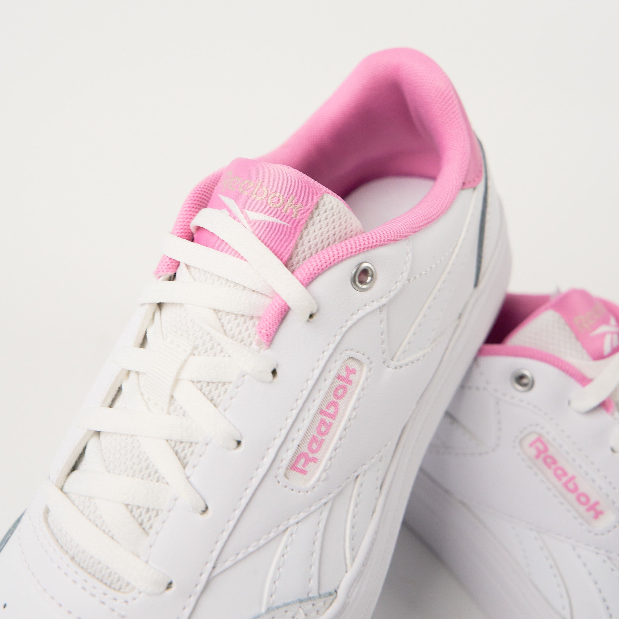 Reebok pink and white shoes online